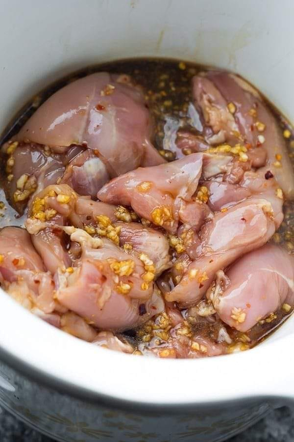 Put chicken in a slow cooker, but what goes on top turns this into an irresistible family meal